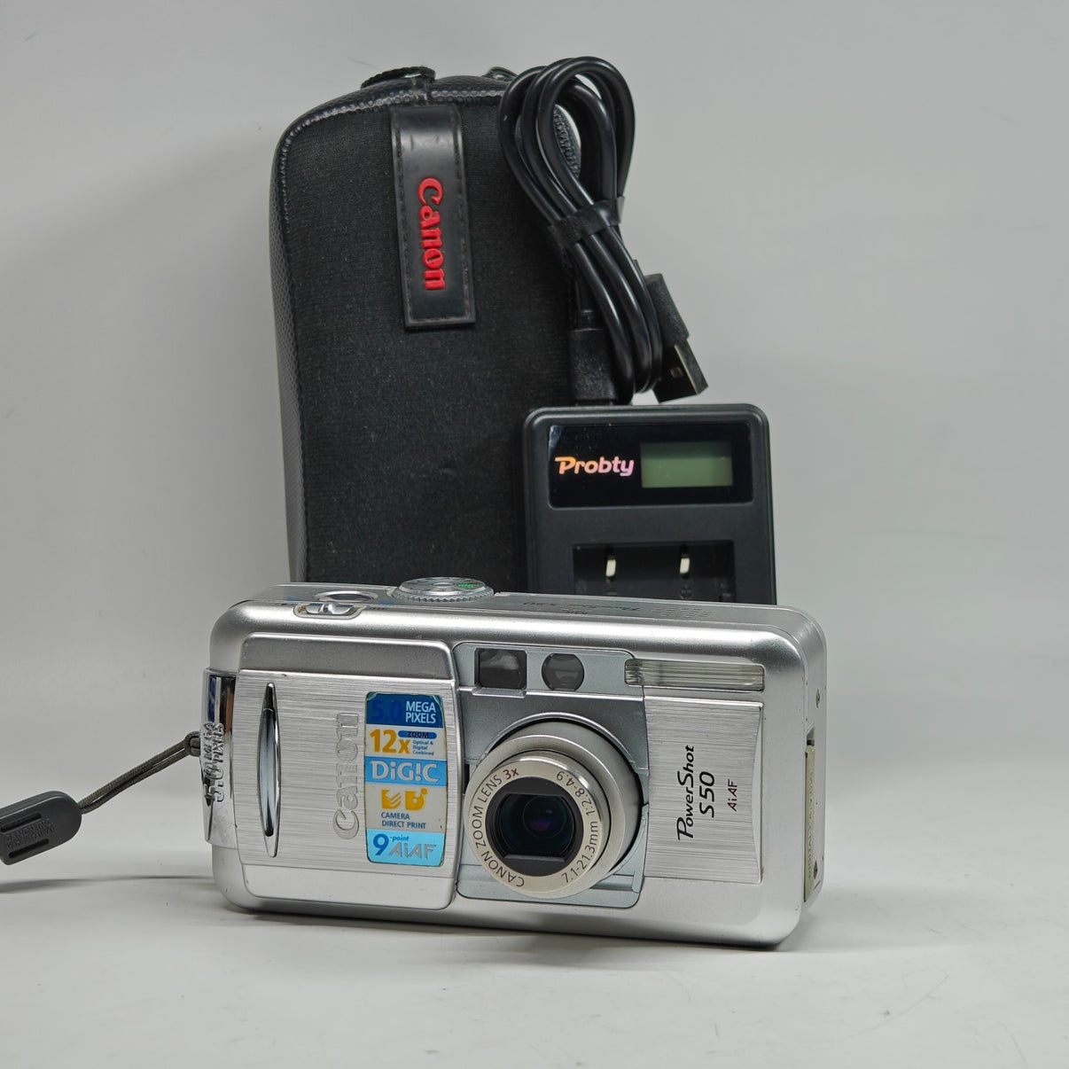 Canon PowerShot S50 Digital Camera Silver 5MP 3x Zoom Retro Digicam + Charger - Native Sole Cameras