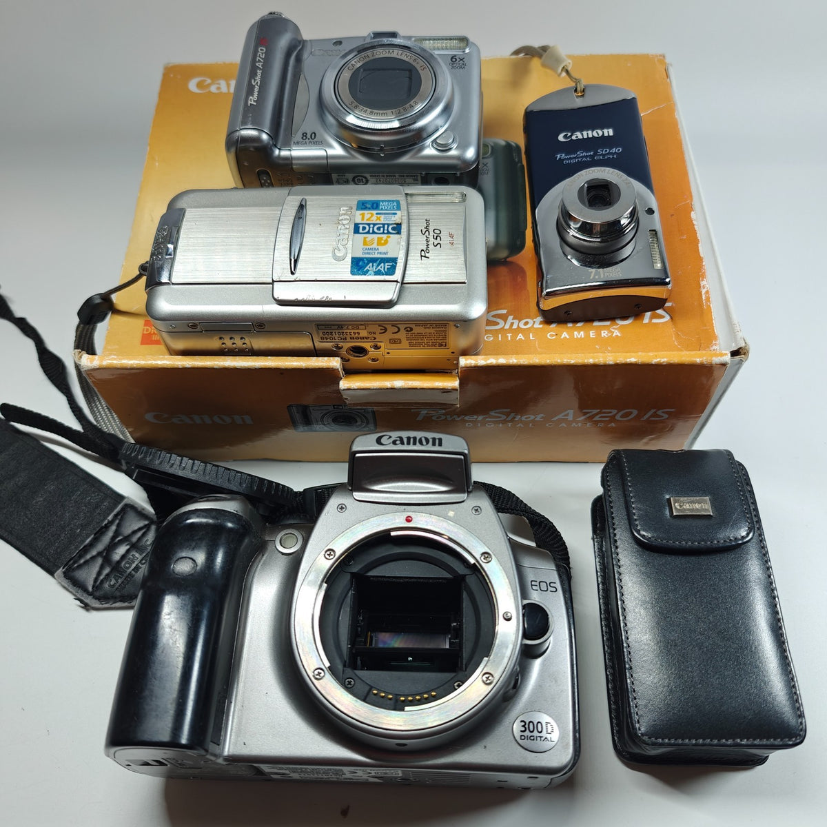 4x Canon Digital Cameras Job Lot - PowerShot S50 A720 IS SD40 EOS 300D Digital - Native Sole Cameras