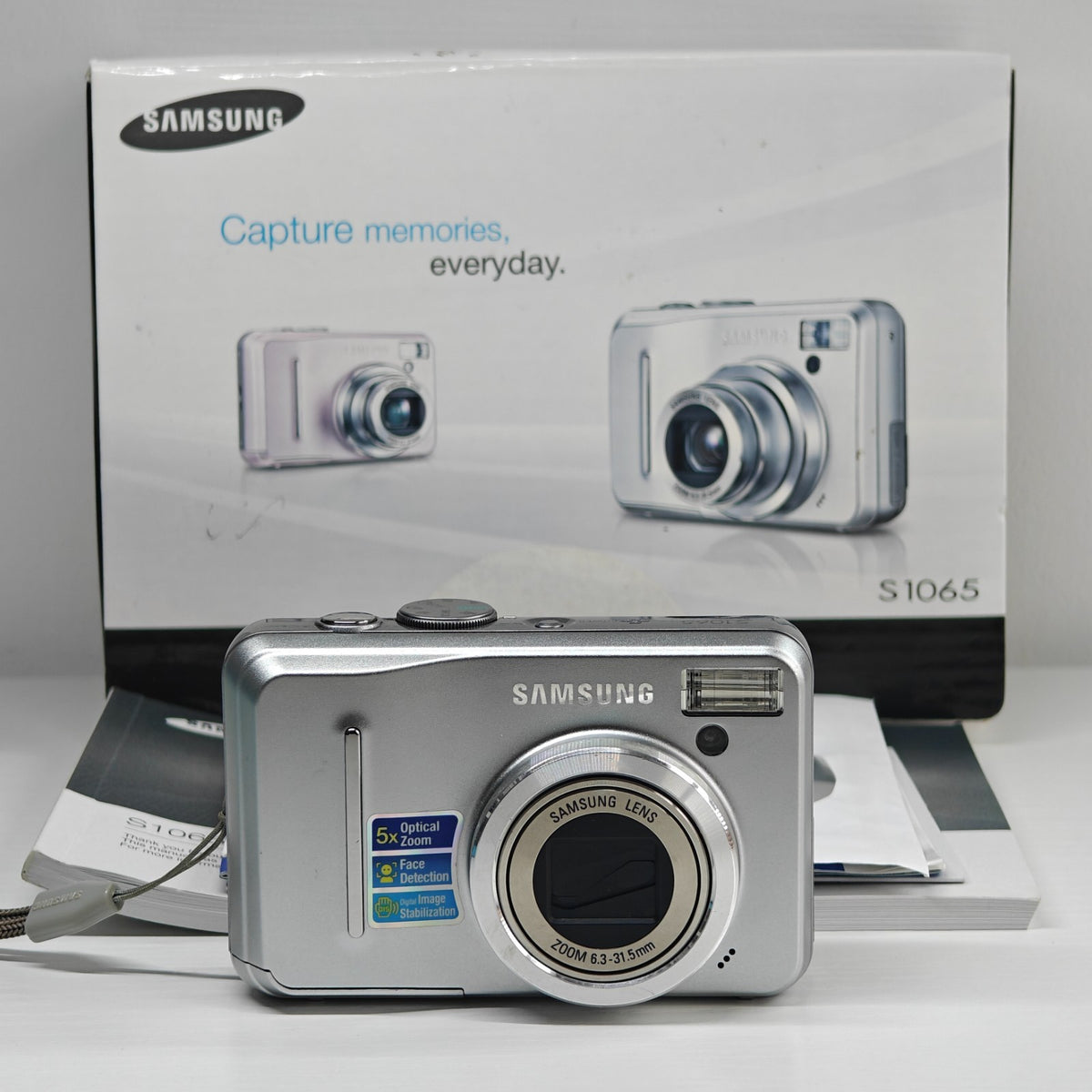 Samsung S1065 10.2MP Digital Camera Silver 5x Zoom Compact AA Digicam Boxed - Native Sole Cameras